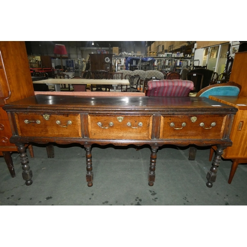 2992 - An early Oak 3-drawer dresser base with turned legs, approximately 180cm wide