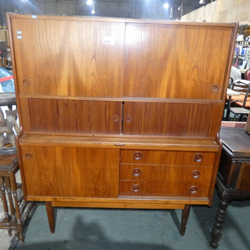 2994 - A 1970s vintage teak sideboard with two sliding doors, 2 tambour doors, sliding door and three drawe... 