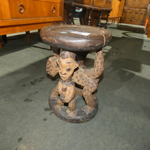 2995 - A carved hardwood tribal stool