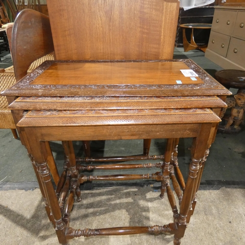 2996 - A nest of three carved hardwood rectangular top coffee tables