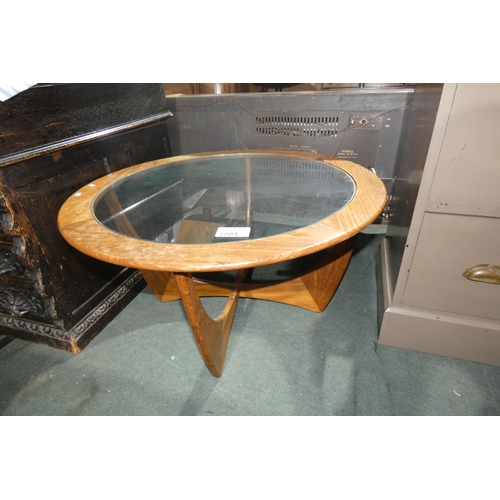 3004 - A 1970s vintage teak circular topped coffee table with inset glass top