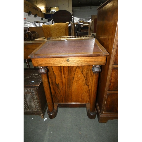 3014 - A 19th Century rosewood Davenport desk with a gallery top, a lift writing slope and side drawers, ap... 