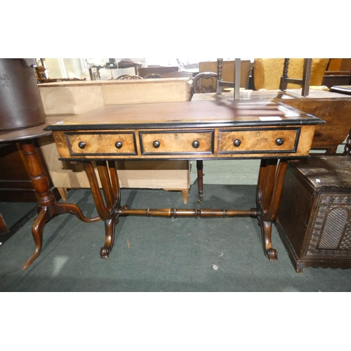 3016 - A 19th Century walnut and ebonised rectangular topped writing table with a tooled leather top and 3 ... 