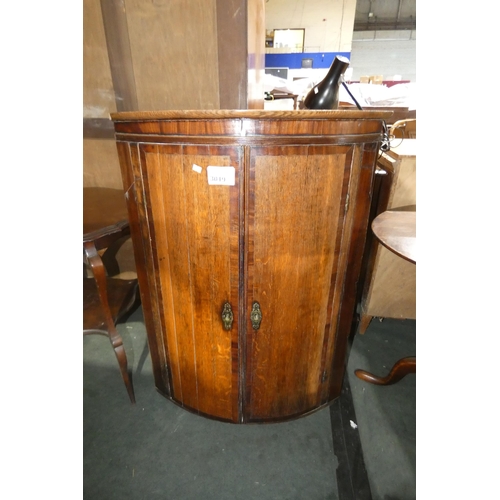 3019 - An early 19th century oak barrel fronted wall hanging cabinet with two doors, approximately 100cm hi... 