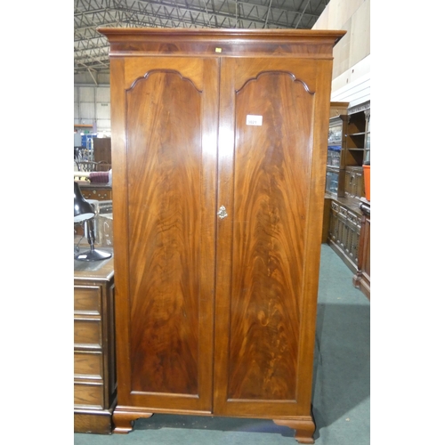 3021 - A mahogany wardrobe with 2 doors enclosing hanging space, 100cm wide