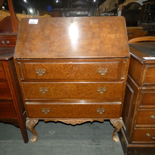 3042 - A walnut bureau with a fall front enclosing a fitted interior and 3 drawers under,  approximately 77... 