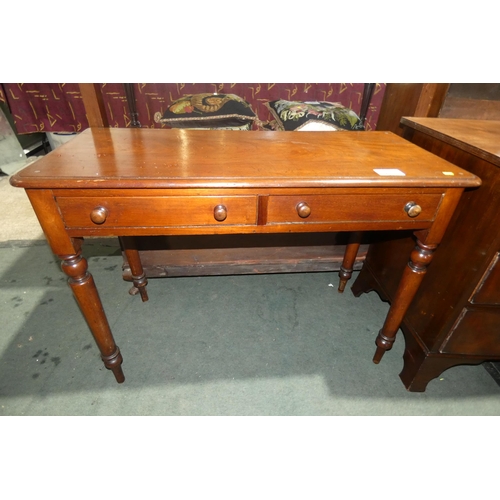 3053 - A Victorian mahogany side table with two drawers on turned legs, approximately 107cm wide