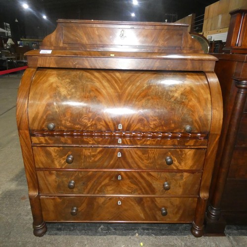 3066 - A fine harewood and mahogany cylinder front Bureau with a fitted interior with secret drawers and co... 