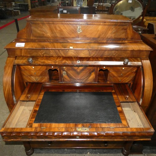 3066 - A fine harewood and mahogany cylinder front Bureau with a fitted interior with secret drawers and co... 