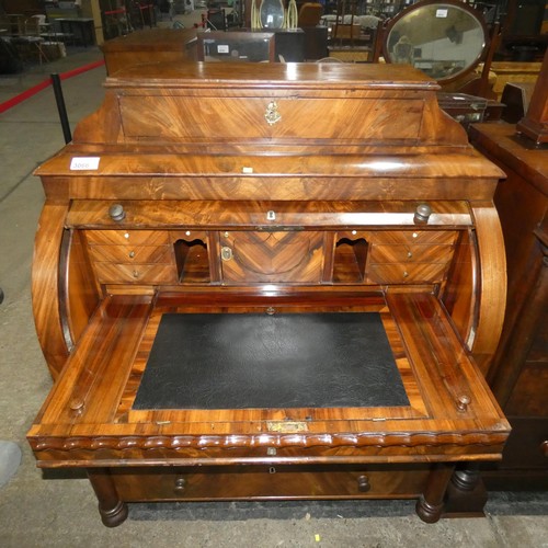 3066 - A fine harewood and mahogany cylinder front Bureau with a fitted interior with secret drawers and co... 