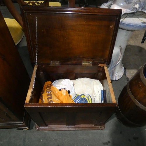 2958 - A floor standing mahogany sewing box with a lift lid and fitted interior