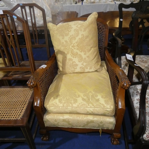 3170 - A mahogany bergere armchair with yellow brocade upholstery