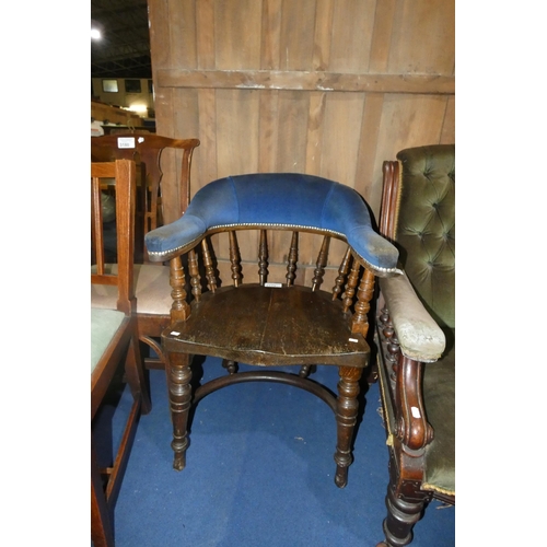 3179 - A dark oak spindle back armchair with a wooden seat and blue upholstery to the arms and back