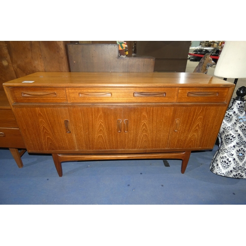 3070 - A 1970s vintage teak sideboard with 3 top drawers and 4 cupboards under, approximately 152cm wide. N... 