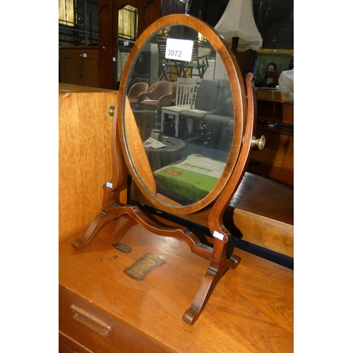 3072 - A Mahogany framed oval dressing mirror