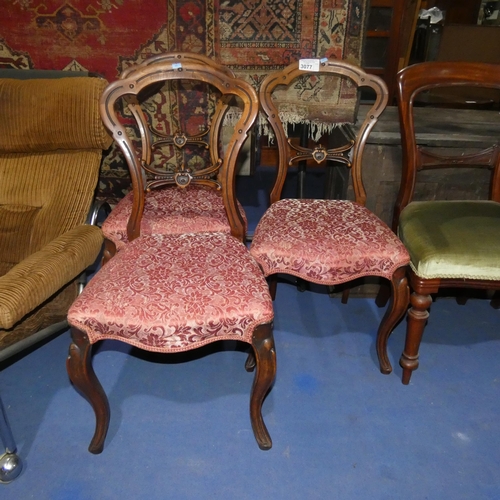 3077 - A set of three Victorian mahogany shaped back dining chairs with red brocade upholstered seat