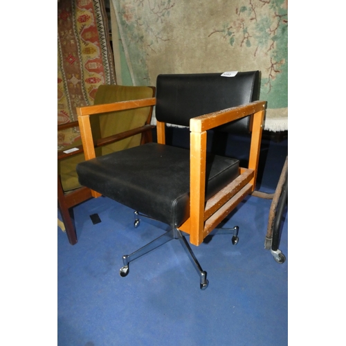 3080 - A 1970s vintage light wood swivel office armchair with black upholstery