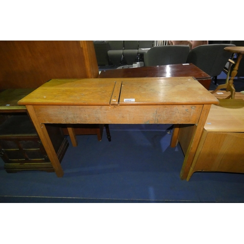 3093 - A vintage light wood double school desk with two lift lids, approximately 119cm wide