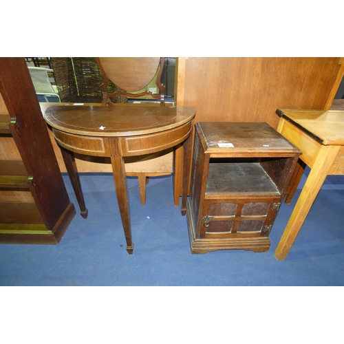 3094 - A dark wood bedside cabinet with an open shelf and 1, door approximately 43 cm wide and a semi circu... 