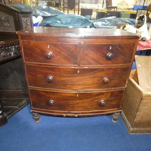 3115 - A 19th Century mahogany bow front chest of 2 short and 2 long drawers with turns knobs, approximatel... 