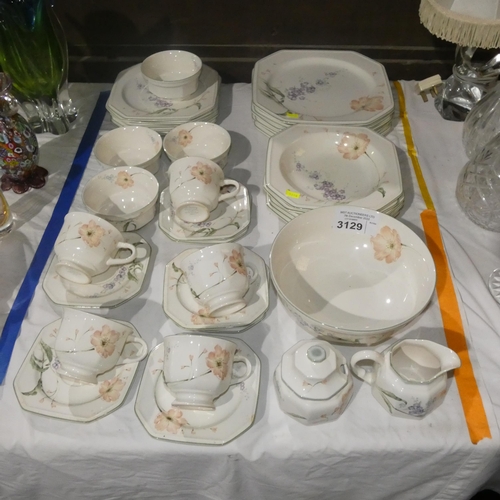 3129 - A quantity of floral decorated breakfast ware