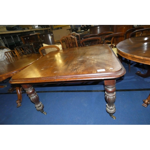 3160 - A Victorian mahogany rectangular topped dining table on turned and bulbous legs, approximately 122 c... 