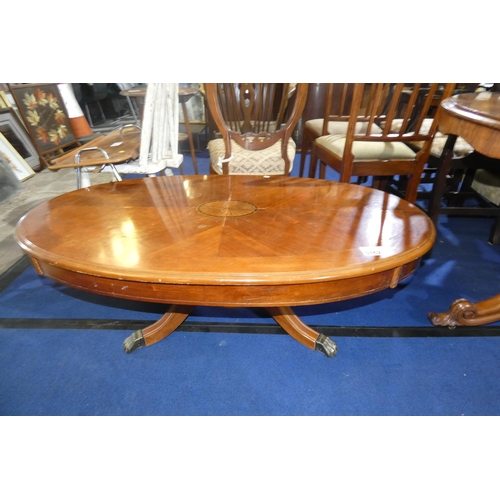 3162 - A marquetry inlaid mahogany oval topped coffee table