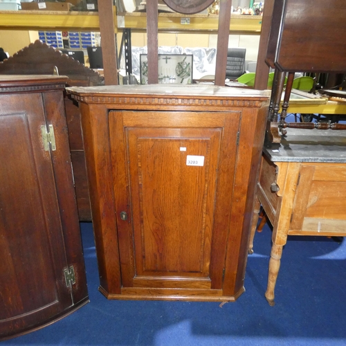 3203 - A 19th Century Oak wall hanging corner cabinet with a panelled door