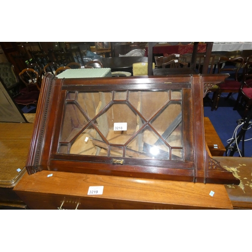 3218 - A reproduction mahogany floor standing corner cabinet with an astral glazed door enclosing shelves