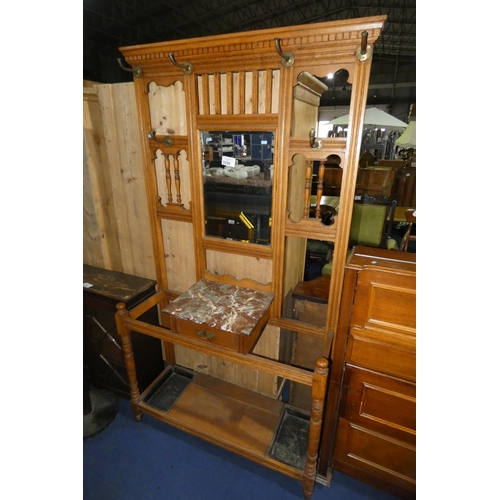 3228 - An Edwardian light oak Hall stand with mirror black & coat hooks, a marble shelf with a small drawer... 