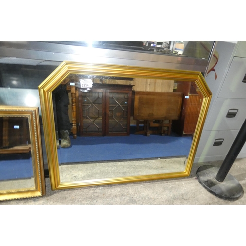 3234 - A gilt framed bevelled overmantle mirror approx 113 cm wide x 87cm high