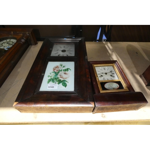 3248 - A decorative American wall clock in a mahogany case and a similar mantel clock