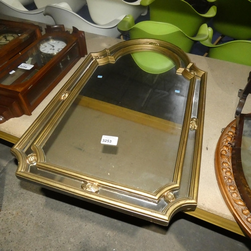 3253 - A decorative gilt framed wall mirror approximately 69 cm wide