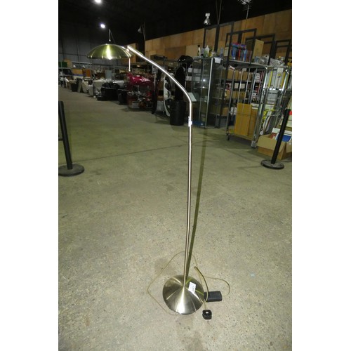 3067 - A brass coloured floor standing adjustable standard spotlight