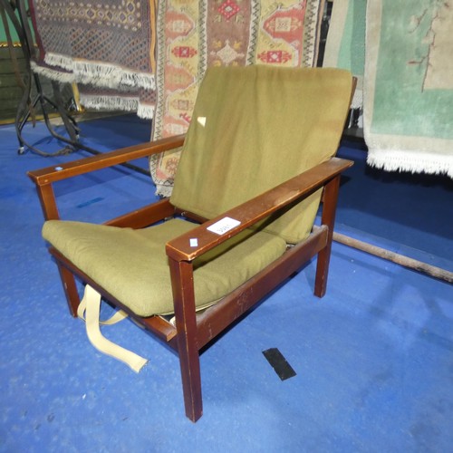 3081 - A 1970s vintage Guy Rogers armchair with green upholstery