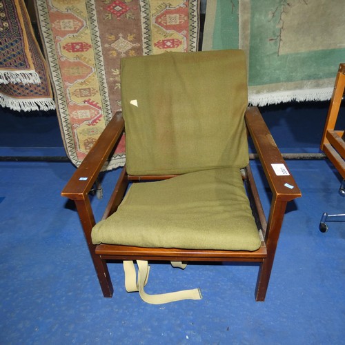 3081 - A 1970s vintage Guy Rogers armchair with green upholstery