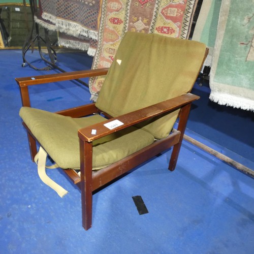 3081 - A 1970s vintage Guy Rogers armchair with green upholstery