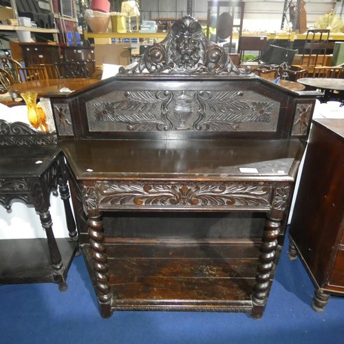 3117 - A heavily carved dark oak hall table with one drawer and an open shelf on twisted legs, approximatel... 