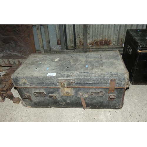 3124 - A vintage leather trunk with a lift lid and side handles