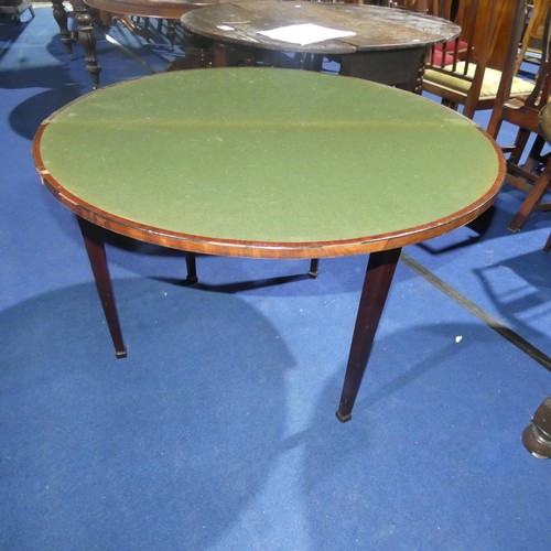 3157 - A 19th Century inlaid mahogany semicircular foldover card table enclosing a green based surface