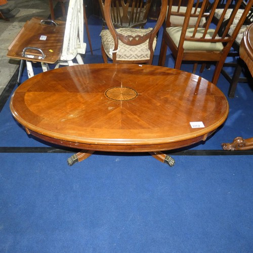 3162 - A marquetry inlaid mahogany oval topped coffee table