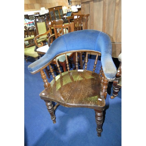 3179 - A dark oak spindle back armchair with a wooden seat and blue upholstery to the arms and back