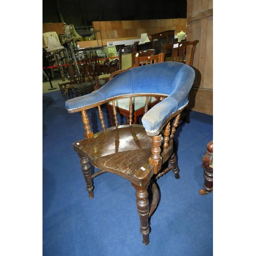 3179 - A dark oak spindle back armchair with a wooden seat and blue upholstery to the arms and back