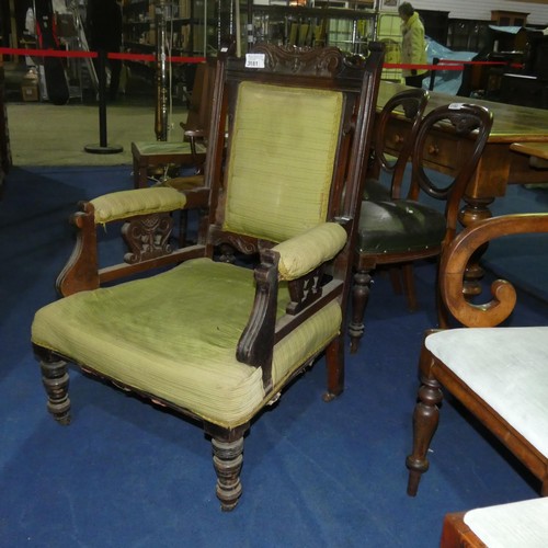 3181 - An Edwardian carved mahogany gentleman's armchair with green upholstery