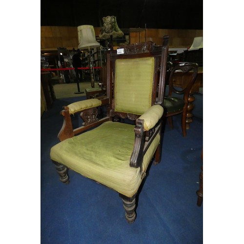 3181 - An Edwardian carved mahogany gentleman's armchair with green upholstery