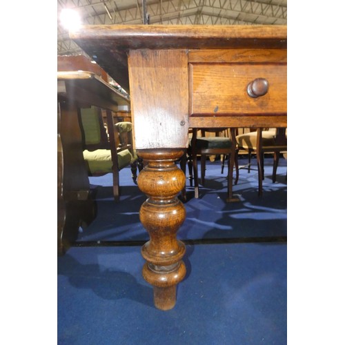3151 - A very large Oak rectangular topped farmhouse refrectory table with 4 drawers with turned knobs, on ... 