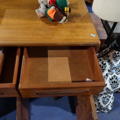 3070 - A 1970s vintage teak sideboard with 3 top drawers and 4 cupboards under, approximately 152cm wide. N... 