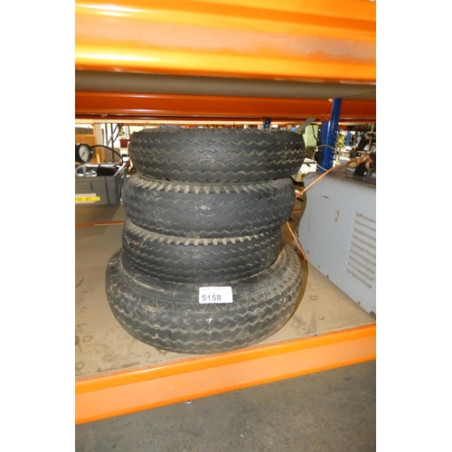 5158 - 4 small wheel rims with tyres fitted (3 appear to be the same and 1 is different)