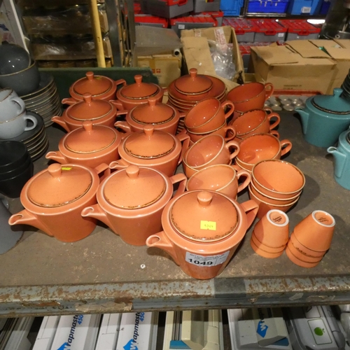 1049 - A quantity of various orange tea/coffee ware crockery by Porcelite type Seasons