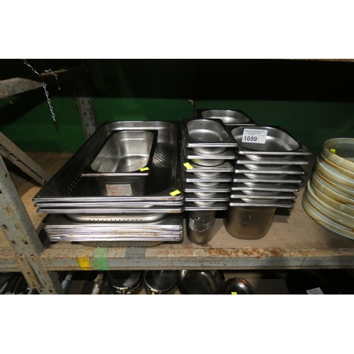 1059 - A quantity of various commercial stainless steel catering type items including baking trays, gastron... 